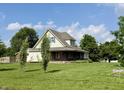 Inviting home featuring a large lawn and traditional design elements at 232 N Church St, Morgantown, IN 46160