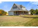 Two-story house with a large front yard at 232 N Church St, Morgantown, IN 46160