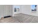 Bright entryway with hardwood floors and carpet at 1116 Bevy Blvd, Danville, IN 46122