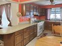 Spacious kitchen with wooden cabinets, functional appliances, and ample counter space at 3305 N Keystone Ave, Indianapolis, IN 46218