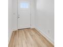 Bright entryway with light wood-look flooring, and white walls and trim at 5759 Cr W 750 N, McCordsville, IN 46055
