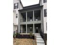 Charming two-story home with a covered porch and classic architectural details offers a welcoming curb appeal at 468 W Smoky Row, Carmel, IN 46032