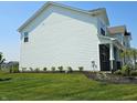 Side view of a two-story home with white siding and manicured landscaping at 236 Sam Himsel Way, Danville, IN 46122