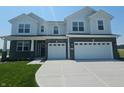 Attractive two-story home featuring a two-car garage, dark brick and light siding at 236 Sam Himsel Way, Danville, IN 46122