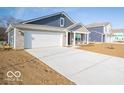 New construction home with a two-car garage and a large driveway at 6036 Card Blvd, Indianapolis, IN 46221