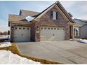 Brick house with 3-car garage, and a large front yard at 5009 Carmine St, Brownsburg, IN 46112