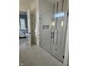 Modern bathroom features a glass shower enclosure with white subway tile and black hardware at 947 W 146Th St, Carmel, IN 46074