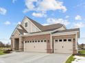 Brick house with 3-car garage, stone accents and landscaping at 4998 Carmine St, Brownsburg, IN 46112