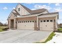Brick house with 3-car garage, stone accents and landscaping at 4998 Carmine St, Brownsburg, IN 46112