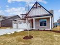 Charming two-story home with a three-car garage and landscaping at 5005 Carmine St, Brownsburg, IN 46112