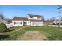 Charming two-story home with red shutters and a well-manicured lawn in a neighborhood setting at 180 N Highland St, Morgantown, IN 46160