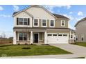 Charming two-story home with a two car garage and a covered entryway, surrounded by a well-maintained lawn and landscaping at 4186 Dutton Dr, Bargersville, IN 46106