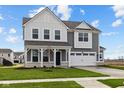 Charming two-story home features a two-car garage, covered porch, and well-manicured lawn at 4193 Bozeman Way, Bargersville, IN 46106