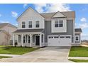 Charming two-story home features a two-car garage, covered porch, and well-manicured lawn at 4193 Bozeman Way, Bargersville, IN 46106