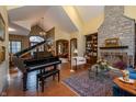 Spacious living room features a stone fireplace, wood floors, and floor-to-ceiling bookshelves at 7258 N Richardson Dr, Morgantown, IN 46160