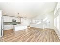 Open concept kitchen with island and stainless steel appliances at 4902 N Park Ave, Indianapolis, IN 46205