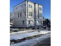 New construction townhome under winter weather at 2611 E New York St, Indianapolis, IN 46201