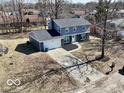Two story home features an attached garage and a well-maintained front yard at 839 Fernwood Ct, Indianapolis, IN 46234