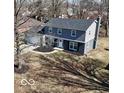Two story home features a well-maintained yard and a classic, welcoming facade at 839 Fernwood Ct, Indianapolis, IN 46234