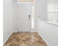 Bright entry with tile flooring and a white door at 2206 Rosswood Blvd, Indianapolis, IN 46229