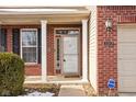 Brick front entry with a white door and sidelights at 2206 Rosswood Blvd, Indianapolis, IN 46229