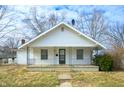 Quaint one-story home with a cozy covered porch and a classic design at 825 Arrow Ave, Anderson, IN 46016