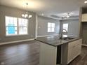 Open living room and kitchen with hardwood floors at 2327 Saddle Dr, Shelbyville, IN 46176