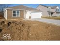 Newly built home showcasing a modern exterior and unfinished yard at 6112 Card Blvd, Indianapolis, IN 46221
