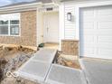 Front entrance of a new construction home with a concrete walkway at 6112 Card Blvd, Indianapolis, IN 46221