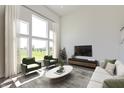 Spacious living room featuring high ceilings, large windows, stylish furniture, and a sleek entertainment center at 1105 Gatewick Ct, Greenwood, IN 46143