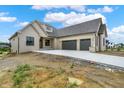 Elegant painted brick home featuring a two-car garage and contemporary design at 5469 Harness Dr, Greenwood, IN 46143
