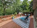 Spacious outdoor deck with a stylish rug and comfortable lounge chairs, perfect for relaxing outdoors at 620 Valley Dr, Martinsville, IN 46151