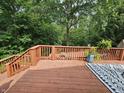View of the wooden deck featuring comfortable seating and lush greenery, offering a tranquil outdoor retreat at 620 Valley Dr, Martinsville, IN 46151