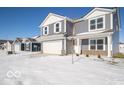 Two-story gray house with white accents and a partially visible neighboring house at 3214 W Keepsake Ln, Monrovia, IN 46157