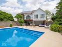 A beautiful backyard pool with spacious patio and outdoor living area at 5784 N 600 E, Greenfield, IN 46140