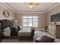 Luxurious main bedroom with a tufted headboard, soft lighting, and a serene atmosphere at 7290 Lockford Walk N, Avon, IN 46123