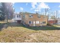 Two-story brick house with a walkout basement and a spacious backyard at 6436 E Hadley Rd, Mooresville, IN 46158