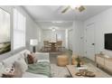 Bright living room features hardwood floors and an open floor plan at 907 S East St, Indianapolis, IN 46225