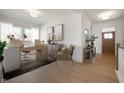 Bright home office features a modern desk, neutral decor, wood floors and plenty of natural light through large windows at 798 Leila Mae Ln, Westfield, IN 46074