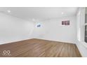 Bright bedroom with wood floors, recessed lighting, and large windows offering natural light at 9344 Anthem Ave, Plainfield, IN 46168