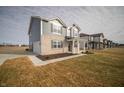 Charming two-story home with brick and siding facade, covered front porch, with attached garage at 7904 Magnolia St, New Palestine, IN 46163