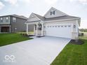 Attractive single-story home with a two-car garage, covered porch, and a well-manicured front yard at 132 Velvet Hat Rd, Danville, IN 46122