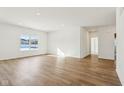 Spacious living room with hardwood floors and large windows at 7098 Sterling Way, Brownsburg, IN 46112
