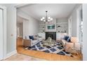 Bright living room with a fireplace, built-in shelves, and a stylish blue rug at 1423 Hoyt Ave, Indianapolis, IN 46203