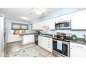 Bright eat-in kitchen with stainless steel appliances and light-colored cabinetry at 383 Carmelaire Ct, Carmel, IN 46032