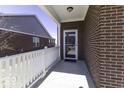 Covered porch with white railings offering shade at 4326 Switchgrass Way, Indianapolis, IN 46237
