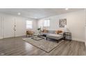 Bright living room with gray sectional sofa and stylish decor at 1529 Harlan St, Indianapolis, IN 46203