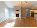 Open living space with fireplace and hardwood floors at 4208 Payne Dr, Plainfield, IN 46168