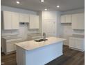 Modern kitchen featuring white cabinets and quartz countertops at 5226 Woodhurst Ln, Indianapolis, IN 46239