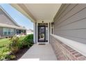 Cozy front porch with brick accents, flower bushes, space to relax and adds curb appeal to the home at 17345 Northam Dr, Westfield, IN 46074